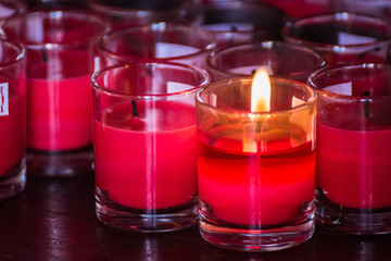 Festival of Lights. Beautiful candle light. Selective focus on foreground of many burning tealight candles.Bangkok, Thailand.