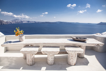 orange tree in a pot in Santorini, Cyclades islands Greece - amazing travel destination