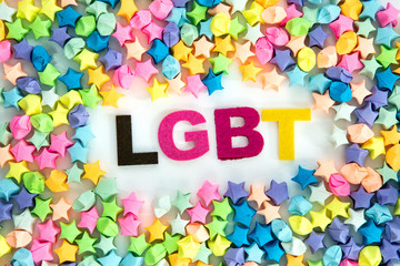 LGBT lettering placed on white background with a colorful star paper craft , diversity LGBT concept