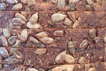 Sliced ​​rye bread with sunflower seeds close-up.