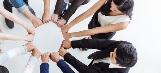 Creative team meeting hands synergy brainstorm business man woman in circle top view on white background. Support teamwork acquisition together international diversity harmony people concept banner