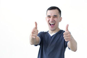 Gesture and people concept - Asian man with smile showing thumb up on white background with copy space