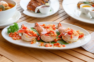 Spicy chili grilled prawns in white plate