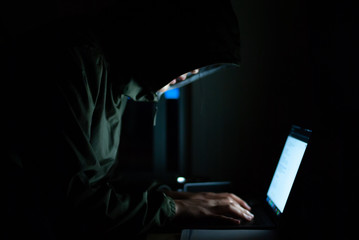 hacker is in a set of black watercolors on the front. Safety concepts of cyber security information.