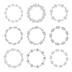 Wreaths and botanical frames on white background.