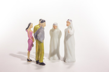 Naklejka premium Group ofminiature businessman and arabian businessman isolated white background. 