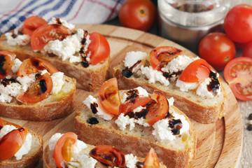 Sandwiches with tomatoes, homemade cheese, olive oil and balsamic sauce	