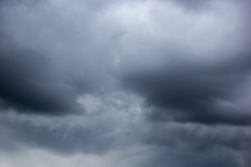 The datk gray storm clouds with thunder on the sky before raining. 