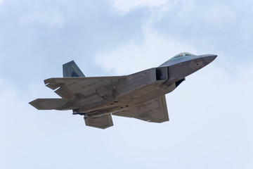 Fototapeta na wymiar Advanced Tactical Fighter Jet Flying Overhead