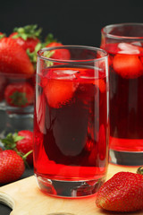 Glasses with strawberry drink with ice