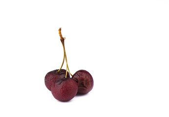 Withered cherry berries on a white background