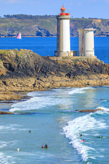Surfing near the lighthouse of  