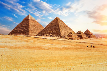 Fototapeta na wymiar The Pyramids in the sunny desert of Giza, Egypt