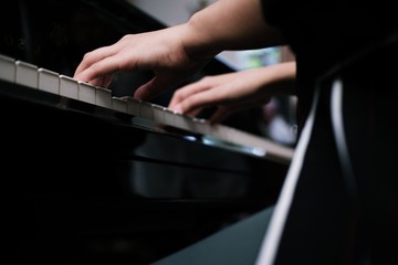 Beautiful asian girl learn to play piano.