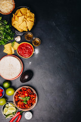Obraz na płótnie Canvas Concept of Mexican food, flat lay, dark background