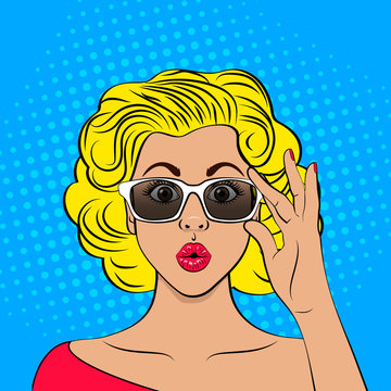Wow pop art female face. Closeup of sexy surprised blonde woman with wide open eyes and open mouth holding her glasses. Vector colorful background in  retro comic style.