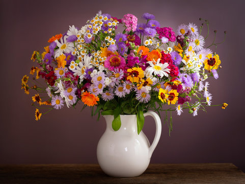 bouquet of summer flowers in a jar