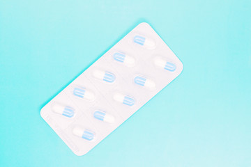 white capsules close up, pills capsules with white powder inside close up, coated medicine, medical...