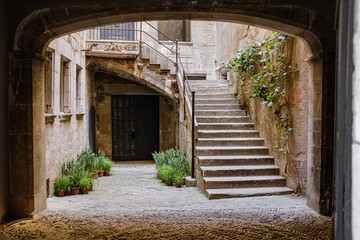 Medieval old stairs and house facade in Girona, Catalonia, in the old jewish town famous landmark