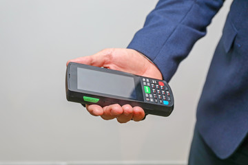 Man Holding Mobile Computer