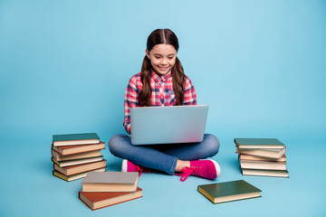 Portrait of nice attractive cheerful smart clever girl nerd wearing checked shirt sitting in lotus...