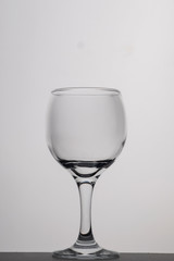 Empty wine glass on a white background. Closeup