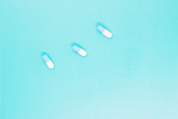 white capsules close up, pills capsules with white powder inside close up, coated medicine, medical...