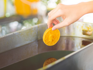 A woman hand holding a pig zodiac candle that made for Buddhist Lent Candle Casting Ceremony in Thailand.