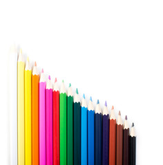 Colored pencils row isolated on white background.