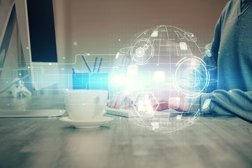 Social network theme hologram with businessman working on computer on background. Concept of world...