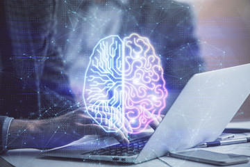 Man typing on keyboard background with brain hologram. Concept of big Data.