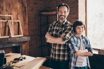 Two nice person cheerful cheery content ready artisan woodworkers handymen folded arms at school course class studio modern loft industrial brick interior indoors