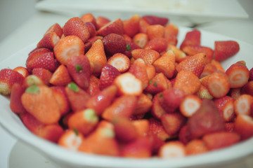 Red strawberries in a white plate