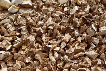 Mushrooms dried on the table. Mushrooms are peeled and cut into pieces. Drying products in the sun.