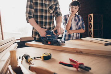 Cropped view of two nice creative person master handyman artisan dad fixing creating construction...