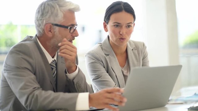 Corporate business colleagues working together in modern office
