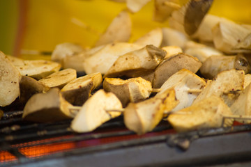 Grilled king oyster mushroom selling on night market., Thailand famous street food.