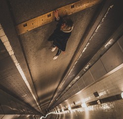 Woman falling down tunnel