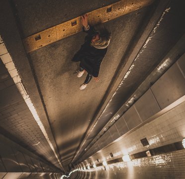 Fototapeta Woman falling down tunnel