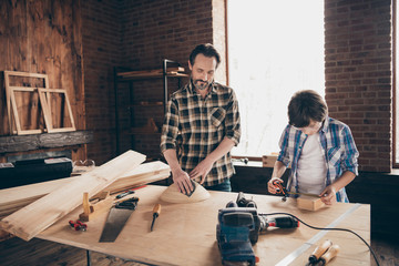 Two nice focused concentrated hard-working person master builder artisan engineer building fixing...