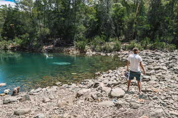 Fototapeta na wymiar skipping stones in Blue river at Douglas Apsley National Park Tasmania Australia