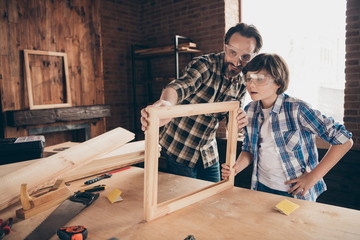 Portrait inspired child boy positive cheerful daddy craftsmen occupation workstation masterclass...