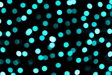 Unfocused abstract colourful bokeh black background. defocused and blurred many round blue light