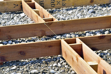Exterior construction: Concrete slab making for parking lot. A framework to assemble before pouring...