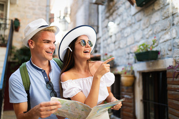 Happy group of friends enjoying traveling and vacation