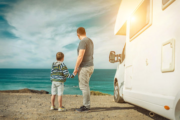 Happiness father and son, stay near them white travel car and lo