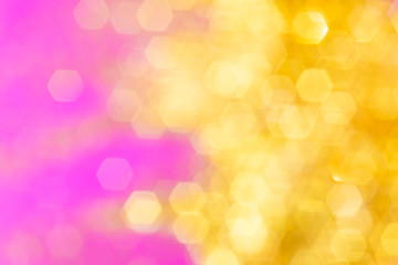 Blurred background - pink surface with gold sparkles. Abstract image. Bright color. Abstract...
