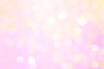 Blurred background - pink surface with gold sparkles. Abstract image. Bright color. Abstract circular bokeh.