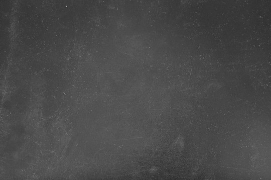 Dust and scratches design. Faded black background. Aged gray surface. Copy space.