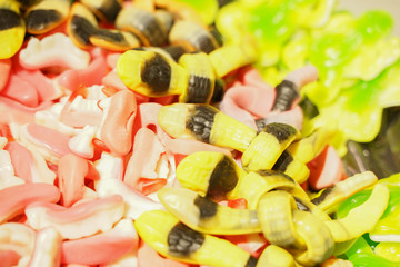 delicious multi-colored fruit marmalade. unhealthy bright candies in bulk. different jelly photo close. tasty sweets in the candy shop. nobody. 